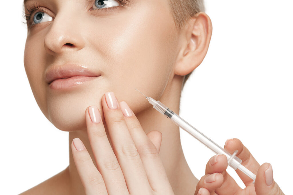 People, Lips, cosmetology, plastic surgery and beauty concept - beautiful young woman face