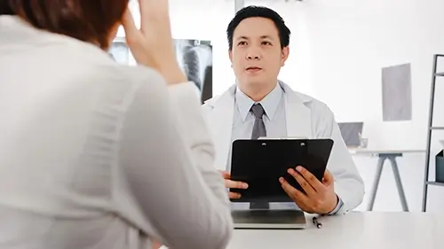 serious asia male doctor