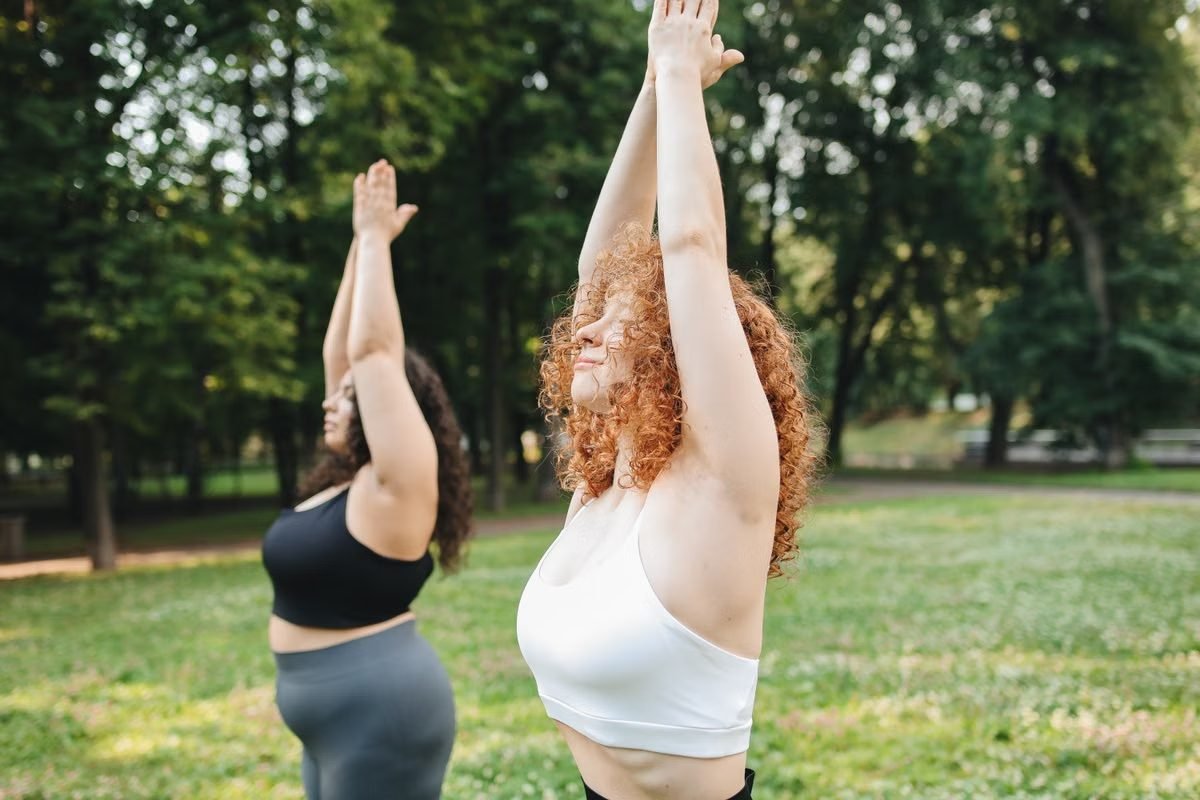 How Much Weight Can I Lose In a Month? 1 Two women exercising outside